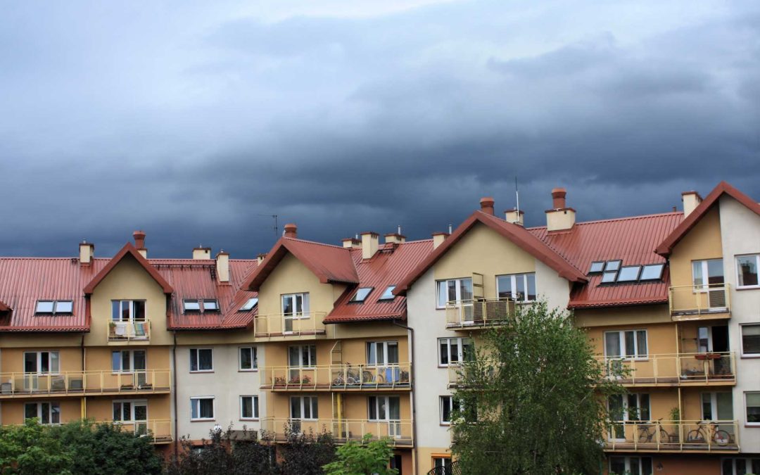 dark storm clouds over condominiums