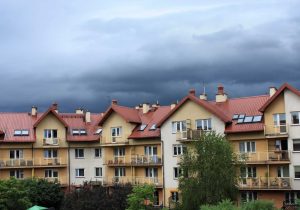 dark storm clouds over condominiums